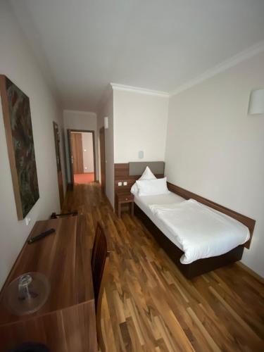 Ένα ή περισσότερα κρεβάτια σε δωμάτιο στο Hotel Isabella