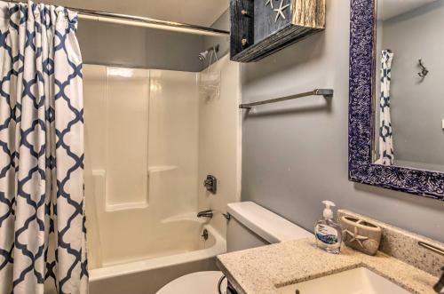 a bathroom with a shower and a toilet and a sink at Beach Lovers Haven Oceanfront Condo with Pool! in Myrtle Beach