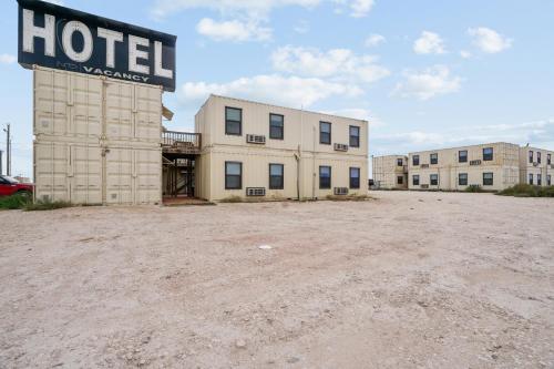 an empty parking lot in front of a hotel at The Resource Inn -Big Lake TX in Big Lake