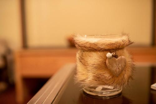 a stuffed animal sitting on top of a table at Hotel Martellerhof in Martello