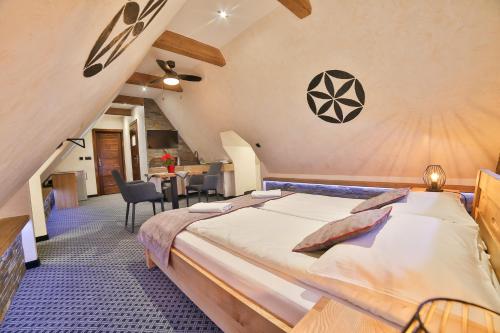 a bedroom with a large bed in a room at Willa Śwarna I in Zakopane