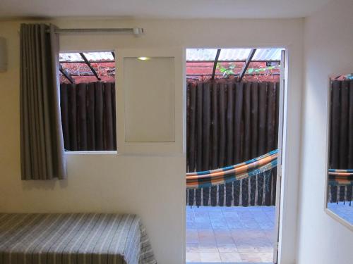 Cama o camas de una habitación en Pousada Tatuapara