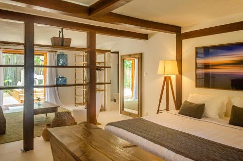Llit o llits en una habitació de Villas de Gaia Hotel Boutique
