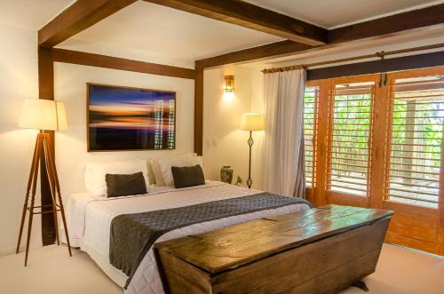 Ένα ή περισσότερα κρεβάτια σε δωμάτιο στο Villas de Gaia Hotel Boutique