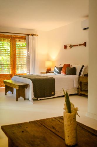 Ένα ή περισσότερα κρεβάτια σε δωμάτιο στο Villas de Gaia Hotel Boutique