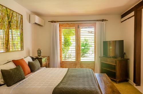 Ένα ή περισσότερα κρεβάτια σε δωμάτιο στο Villas de Gaia Hotel Boutique