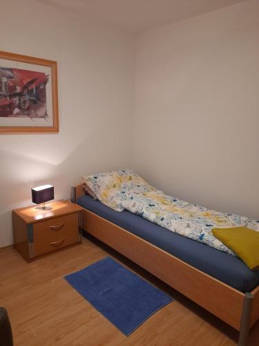 En eller flere senge i et værelse på Gästehaus Atrico Haus 4