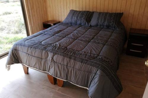Postel nebo postele na pokoji v ubytování Cabaña Con Tinajas #2