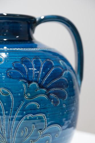 a blue vase with a blue flower painted on it at Cattolica Apartments in Cattolica