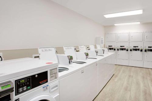 a laboratory with a row of machines in a room at WoodSpring Suites Daytona Beach Int'l Speedway in Daytona Beach