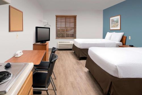 Postel nebo postele na pokoji v ubytování WoodSpring Suites Killeen