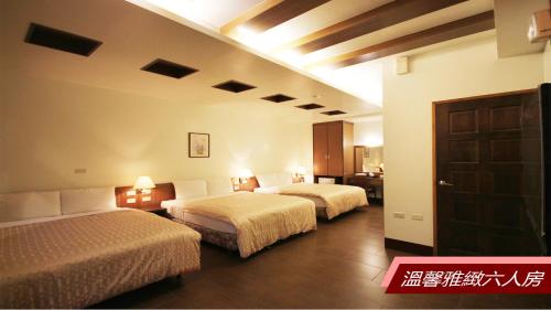 Cama o camas de una habitación en Sheng Shine Forest Resort