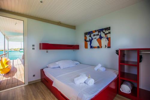 Postel nebo postele na pokoji v ubytování Aqualodge Guadeloupe