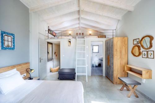 a bedroom with a bed and a loft bed in a room at Villa Levande in Sfinárion