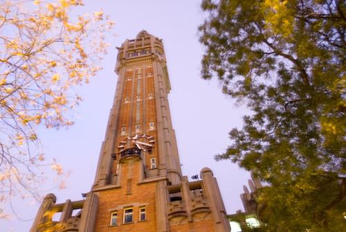 a tall building with a clock tower on top at Ibis Budget - Lille Villeneuve D'Ascq in Villeneuve d'Ascq