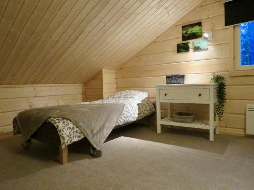 Un pat sau paturi într-o cameră la B&B Adventures