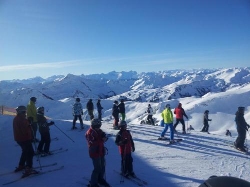 a group of people standing on a ski slope at Ferienwohnung Schnetzer Au in Au im Bregenzerwald