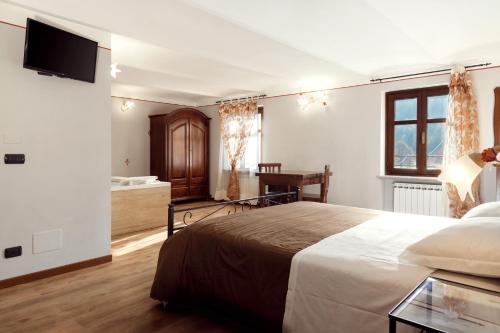 Кровать или кровати в номере 'L Piasi