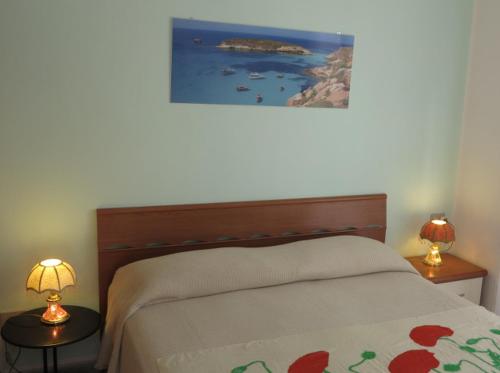 Ένα ή περισσότερα κρεβάτια σε δωμάτιο στο La Mia Isola