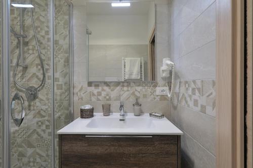 a bathroom with a sink and a shower at Meridiana B&B in Palermo
