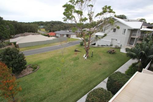 an aerial view of a yard in front of a house at Aston Hill Motor Lodge in Port Macquarie