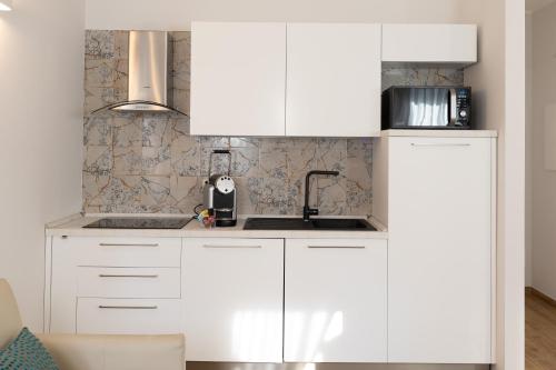 Η κουζίνα ή μικρή κουζίνα στο Ca' Benedetta Suite House Apartsuite Chioggia