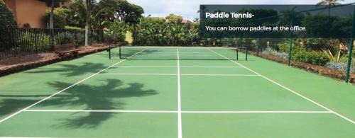 a tennis court with a net on top of it at 9B EKAHI VILLAGE-STUDIO BATH, GARDEN VIEW - 1 MINUTE STROLL to BEACH! in Wailea