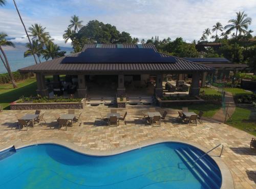a resort with a swimming pool and a pavilion at 9B EKAHI VILLAGE-STUDIO BATH, GARDEN VIEW - 1 MINUTE STROLL to BEACH! in Wailea