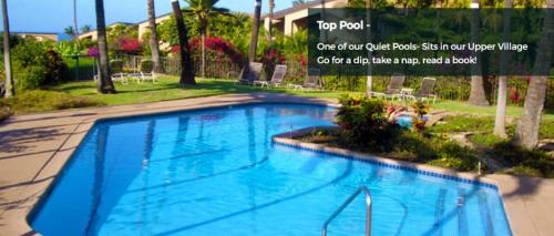 a large blue swimming pool in a yard at 9B EKAHI VILLAGE-STUDIO BATH, GARDEN VIEW - 1 MINUTE STROLL to BEACH! in Wailea