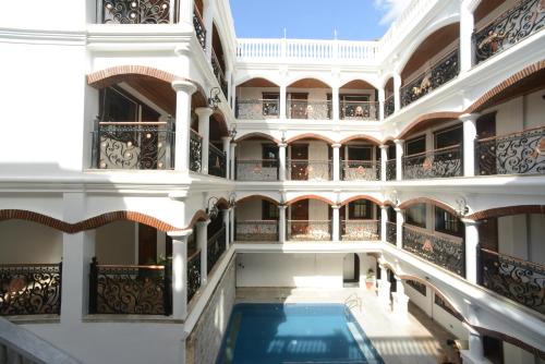 a view of a building with a swimming pool at Hotel Luna in Vigan