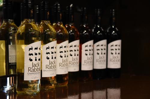 a row of wine bottles sitting on a table at The Llanelwedd Arms Hotel in Builth Wells