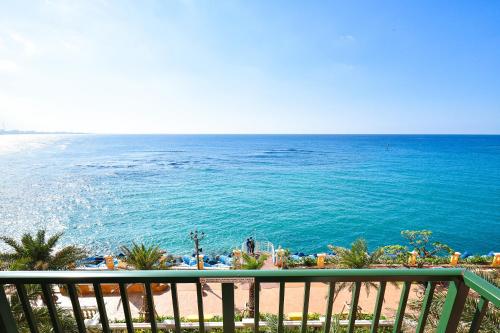 a view of the ocean from the balcony of a resort at Vessel Hotel Campana Okinawa in Chatan