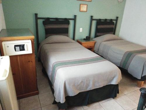 Cama o camas de una habitación en Posada de los Angeles