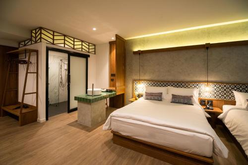 Ένα ή περισσότερα κρεβάτια σε δωμάτιο στο Himku Hotel - adult only