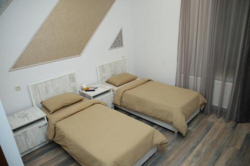 Ένα ή περισσότερα κρεβάτια σε δωμάτιο στο Hotel Gold