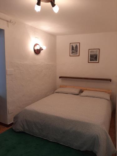 Кровать или кровати в номере Il torrente dell'envers