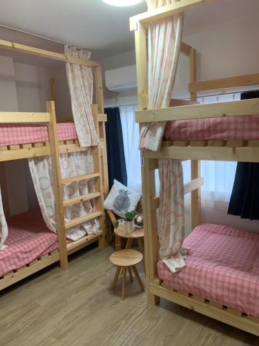 Postel nebo postele na pokoji v ubytování GUEST HOUSE TOKAI nagaragawa
