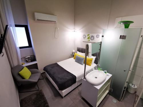 Кровать или кровати в номере Central Boutique Hotel