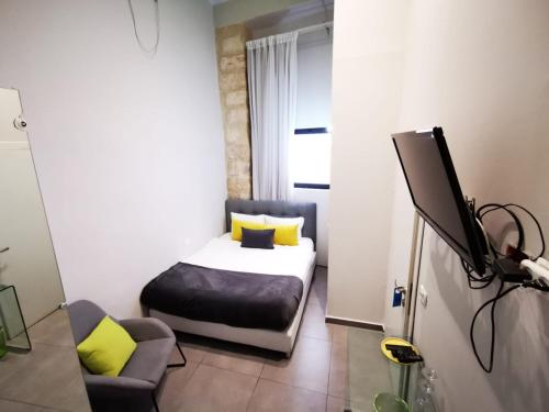 Voodi või voodid majutusasutuse Central Boutique Hotel toas