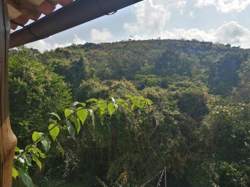 a view of a hill with trees in the background at Casona CHARA in Barichara