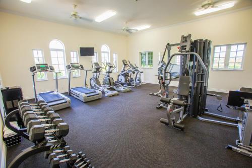 a gym with rows of treadmills and machines at The Venetian on Grace Bay in Grace Bay