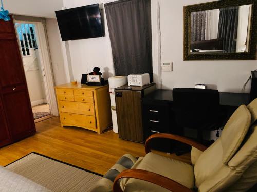 a living room with a couch and a dresser at Nice 2 bedrooms, Massage Seat, close to New York, THE BEST CHOICE!! in North Bergen