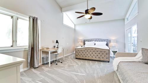 a bedroom with a bed and a desk and a couch at Casa Cortez in Bradenton