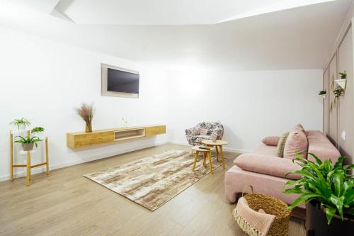 a living room with a couch and a table at LIANE BOUTIQUE HOTEL in Câmpulung Moldovenesc