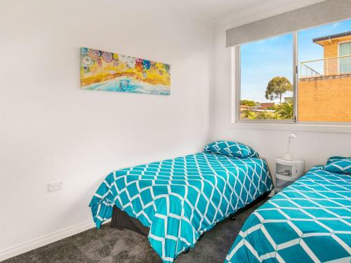 מיטה או מיטות בחדר ב-Beachfront Penthouse Cowes