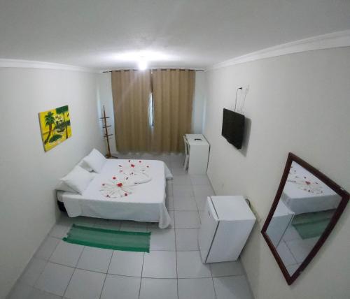 
Cama ou camas em um quarto em Pousada Sal e Mar Maracaipe
