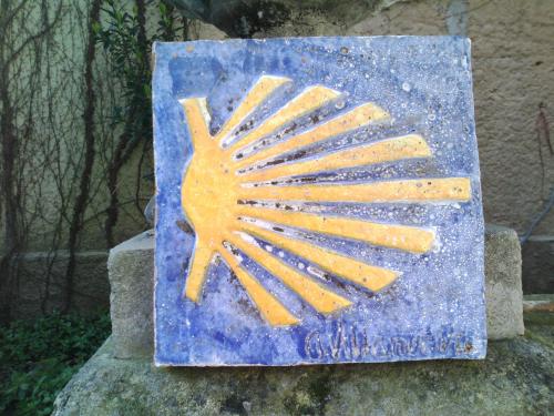 a painting of a sun on a rock at Hotel Villa de Luarca in Luarca