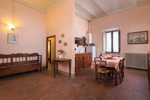 a kitchen and a dining room with a table and a kitchen at Antico Pastificio in Greve in Chianti