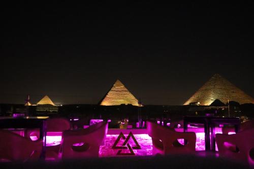 a night scene with lights and lights at night at Magic Pyramids INN in Cairo