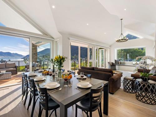 a dining room with a table and chairs at Stonehill Villa - 5 Bed in Queenstown